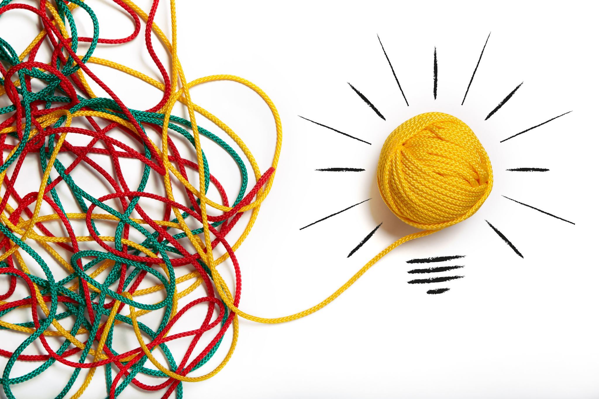 A-colorful-pile-of-yarn-turned-into-a-yellow-yarn-light-bulb